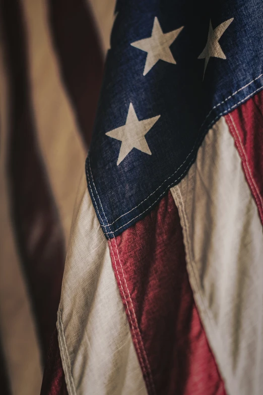 an american flag with gold stars and red white and blue