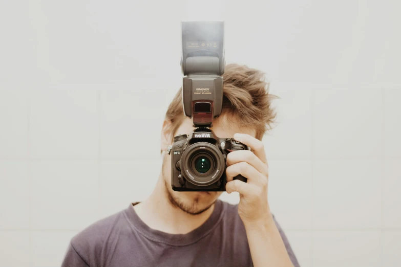 a man takes a selfie of himself in the mirror