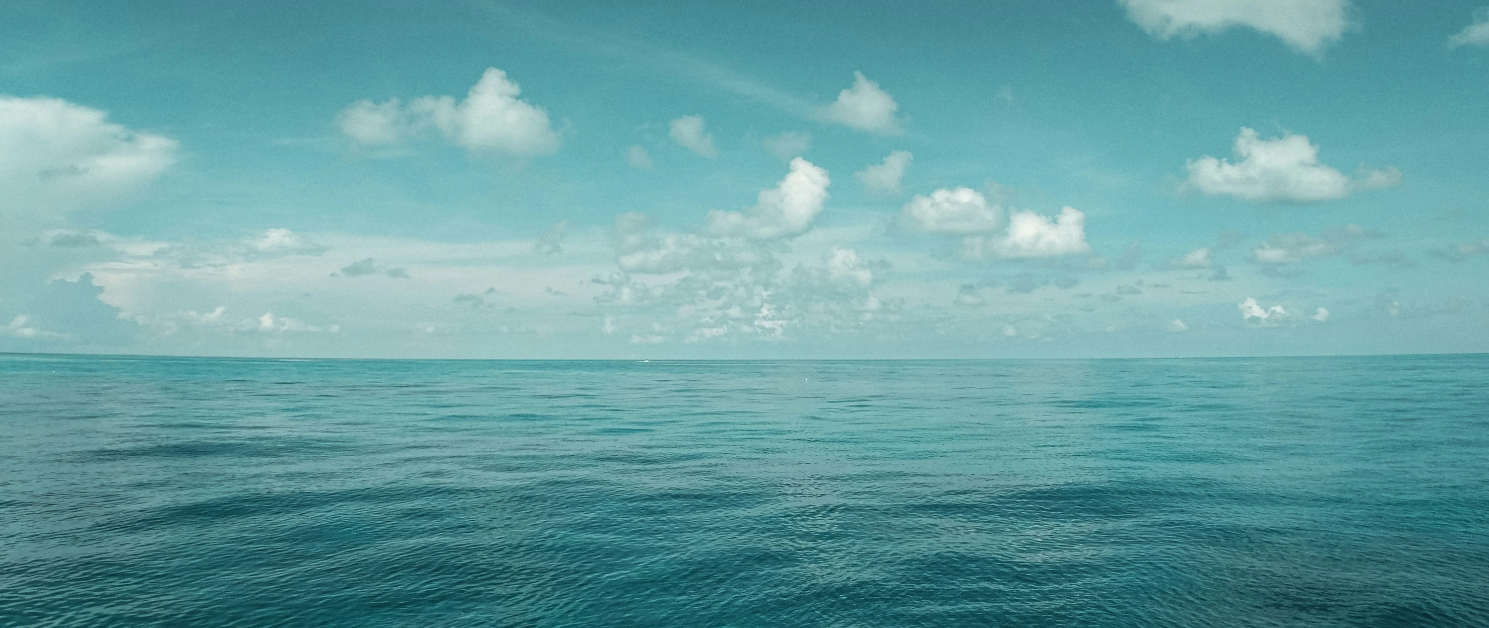 some clouds that are floating in the water