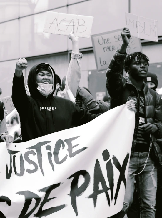 protestors rallying against violence with signs in the middle