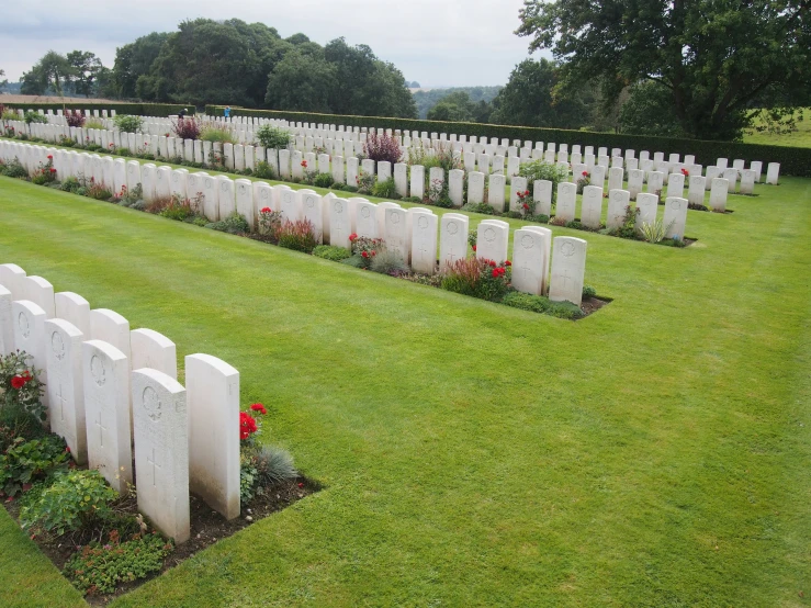 an overview of the military cemetery in this green field