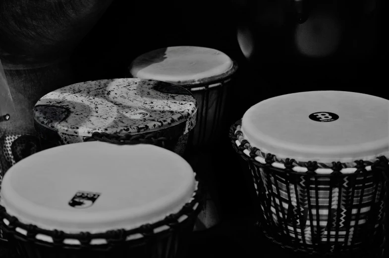 three drums, one in the foreground and another in the back ground