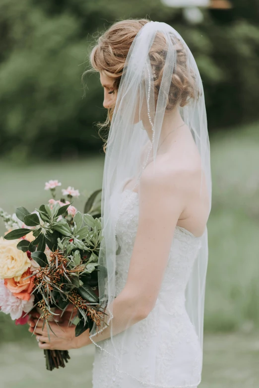 the bride holds her bouquet for the wedding ceremony