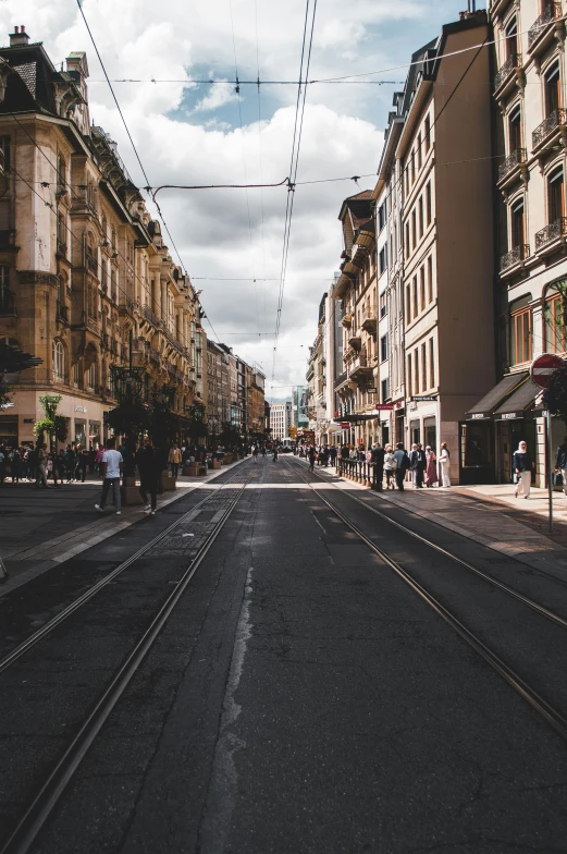 an old street is empty and empty with some cars