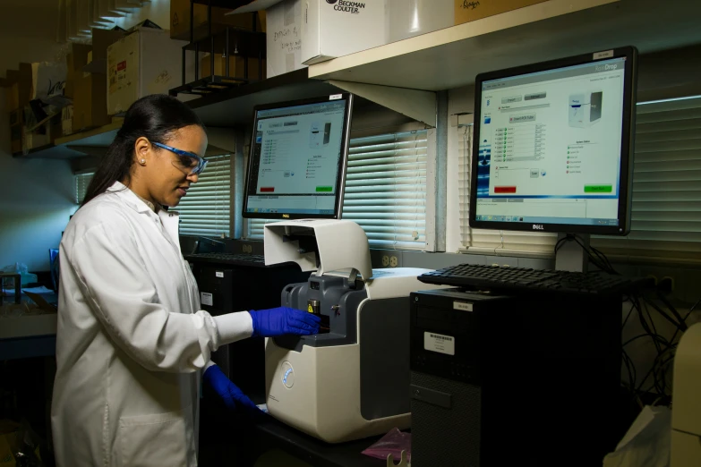 a person working on a machine in a lab