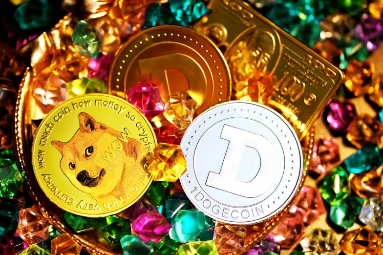 two gold colored bitcoins and a gold colored chip