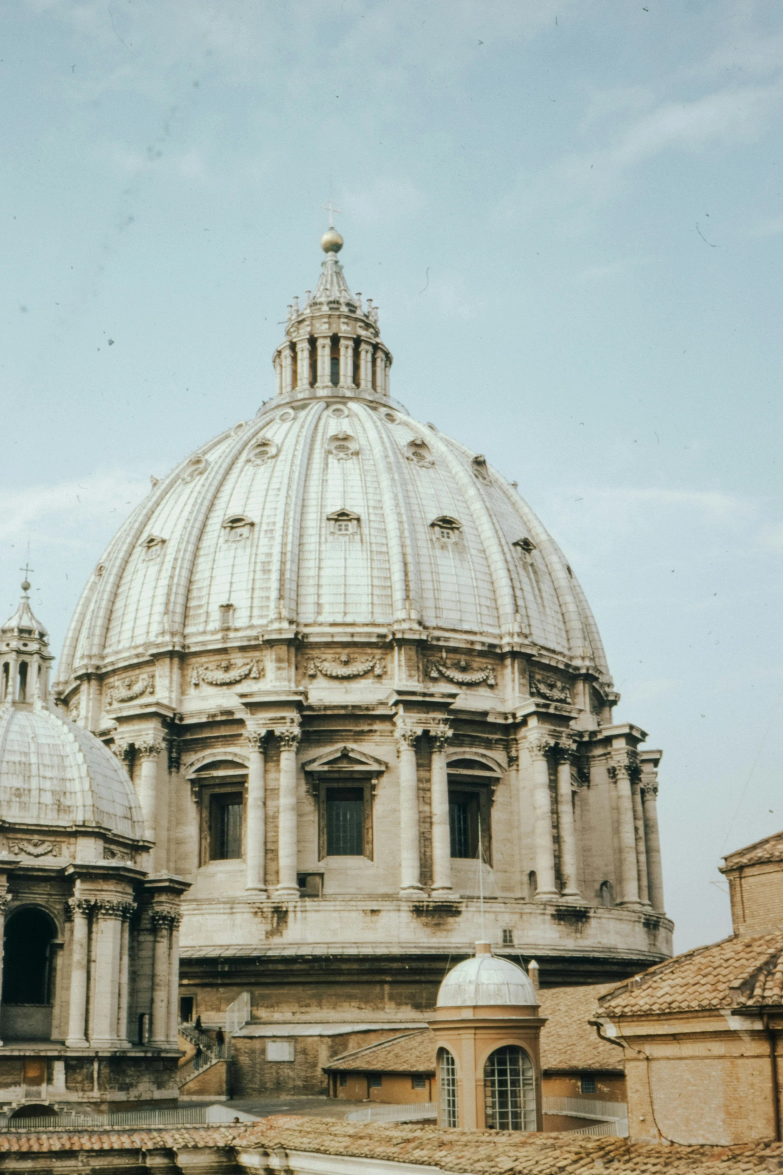 a building with domed roof and small steps in the foreground