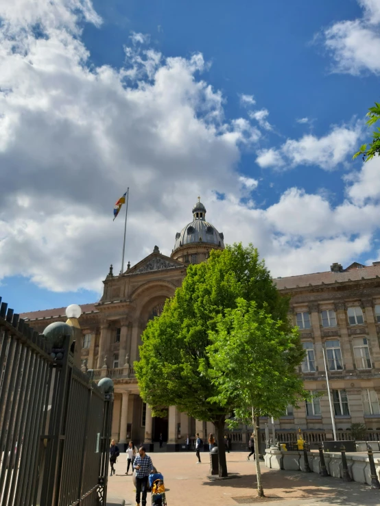 a building with a big dome and sky and trees