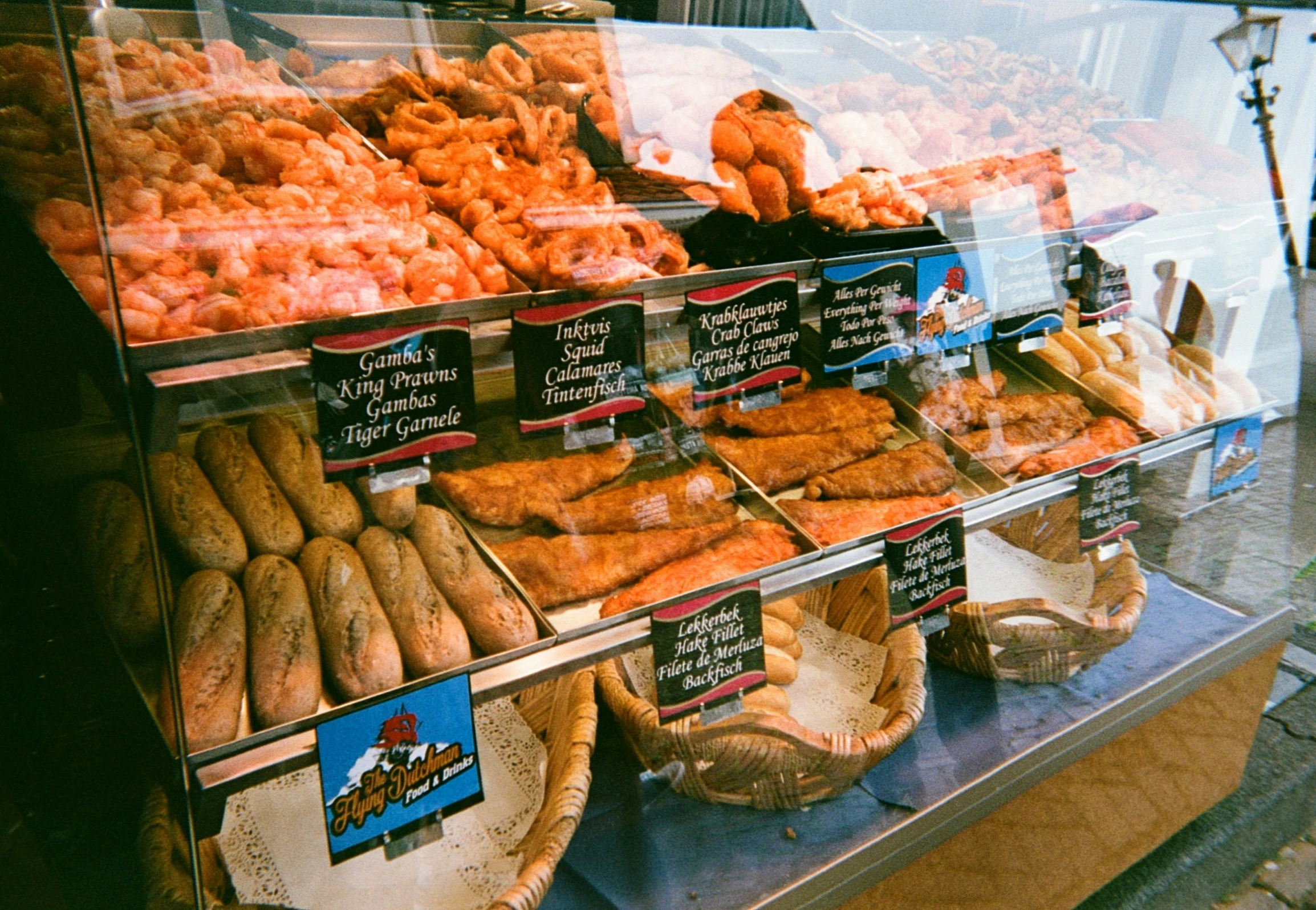 a display in a bakery filled with breads and other items