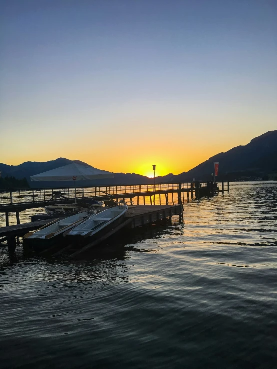 a po taken at a boat dock during sunset