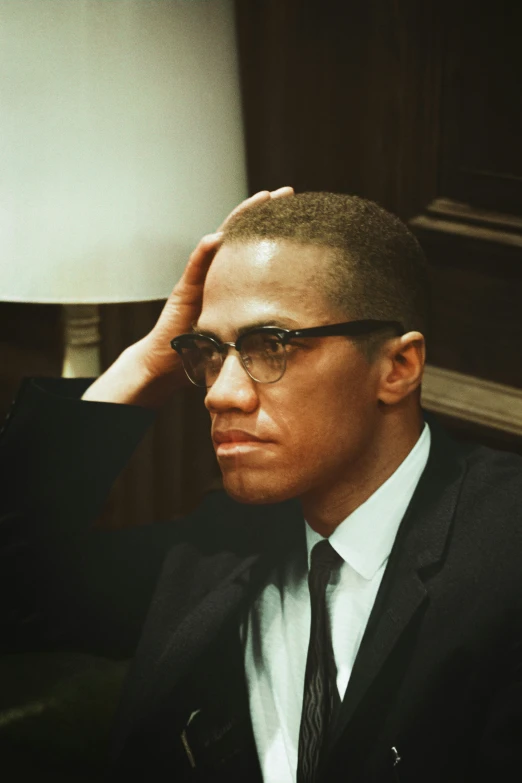 a man in suit and tie looking serious