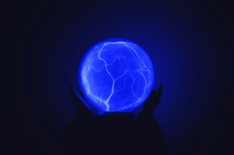 a glowing ball in the dark against a dark background