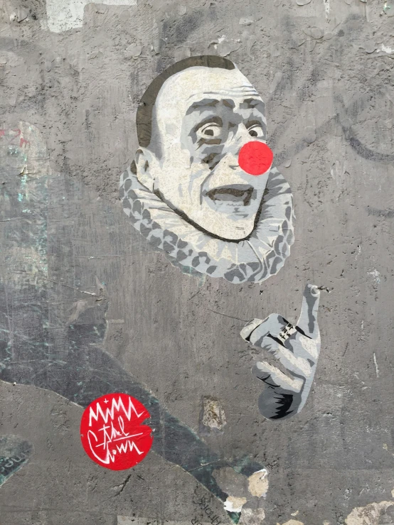 a graffitti of a clown with two fists