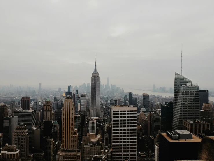 the view of an area that is cloudy and features lots of skyscrs