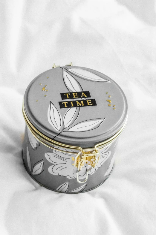 an image of tea tin in the snow