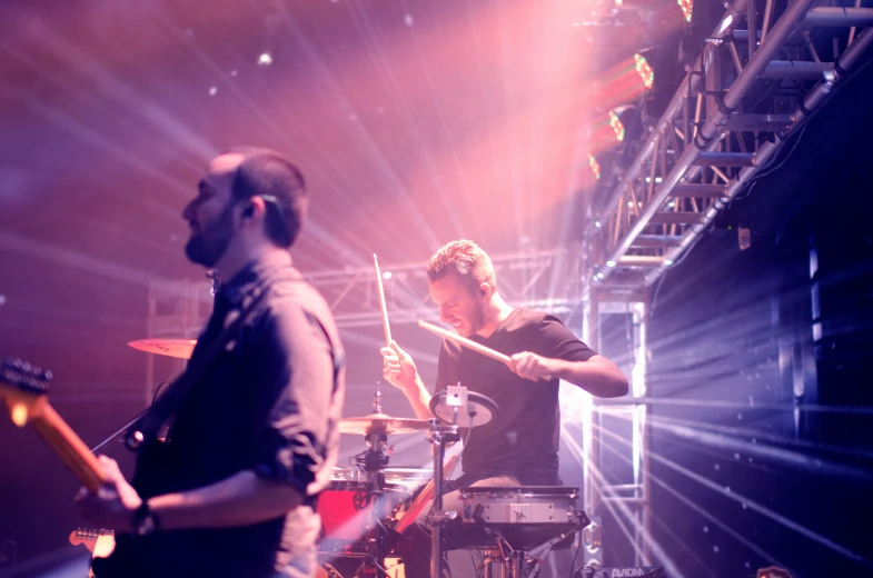 a man on stage playing an electronic device