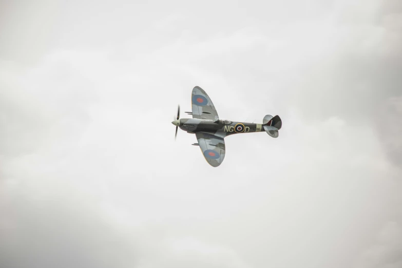 an old propeller plane flying in the air