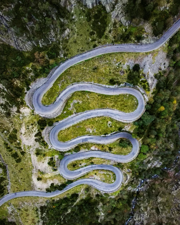 two winding roads in the middle of a field