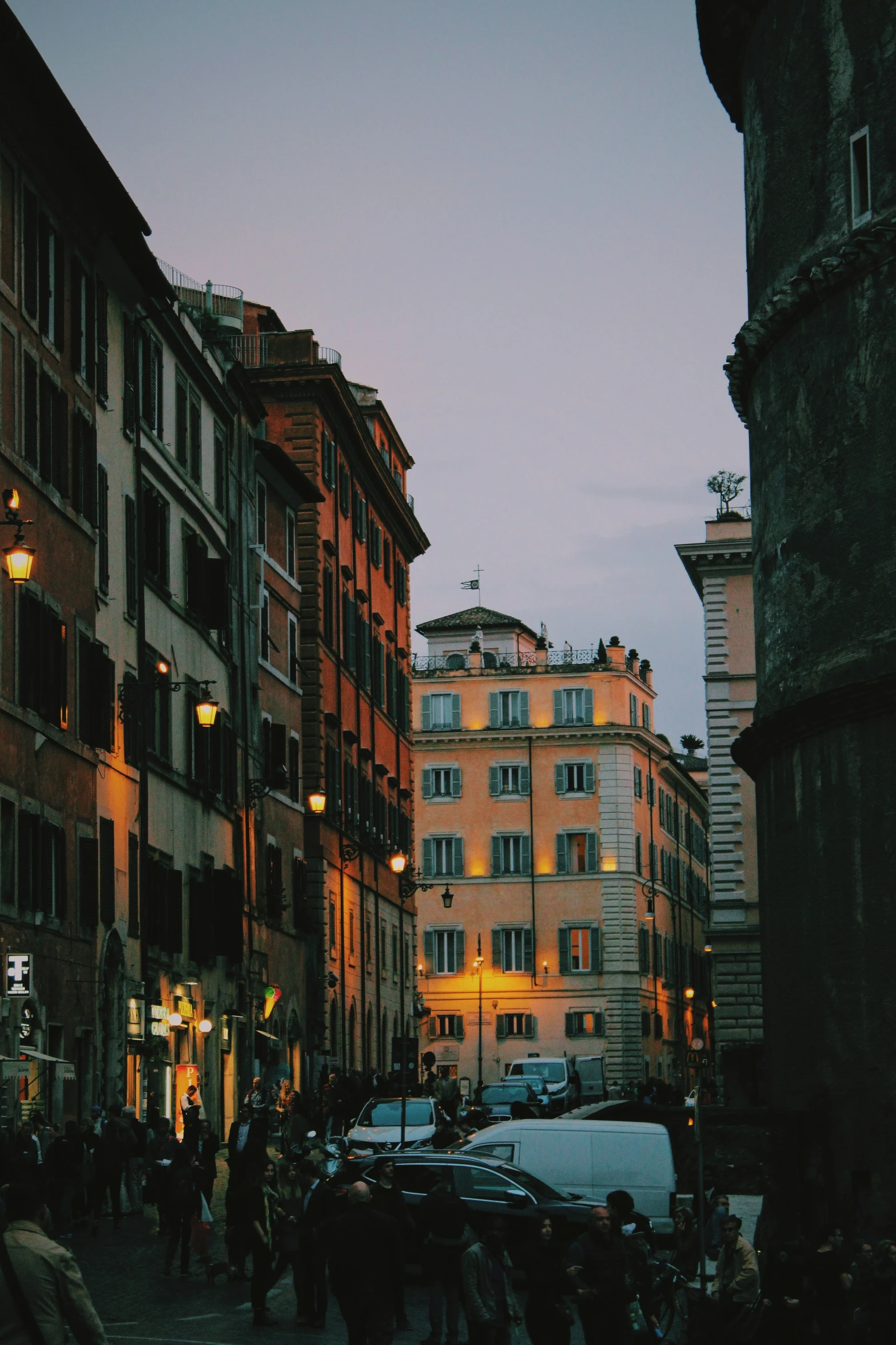 a very tall building next to a bunch of people