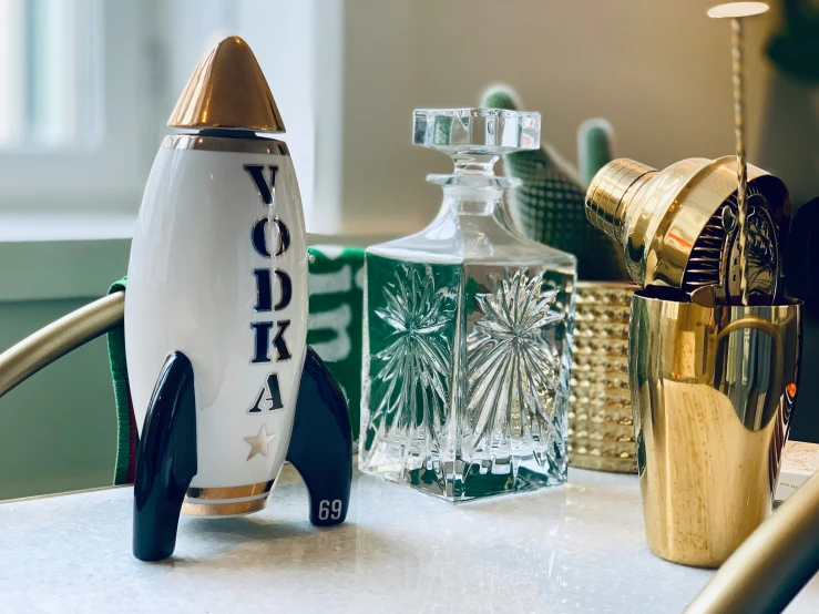 bottles in the shape of a rocket with a star on it