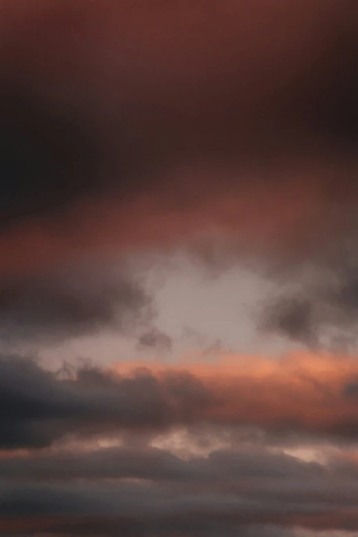 three airplanes flying in the sky and some clouds