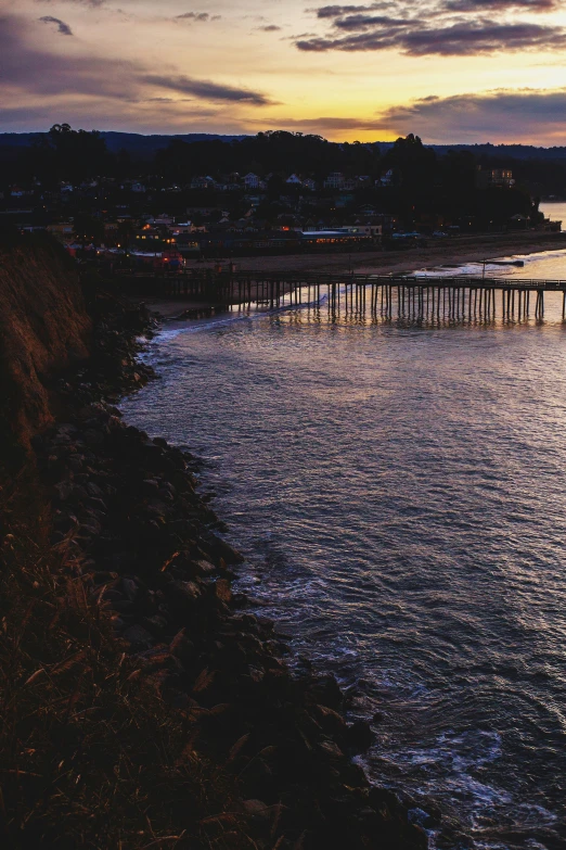 a large body of water with a very long pier