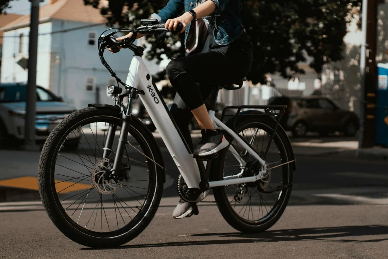 a person riding a bike in the middle of a city