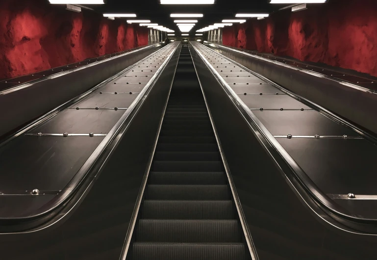 a black and red s of an empty escalator