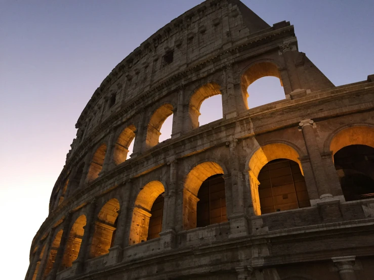 the roman colossion lit up at dusk