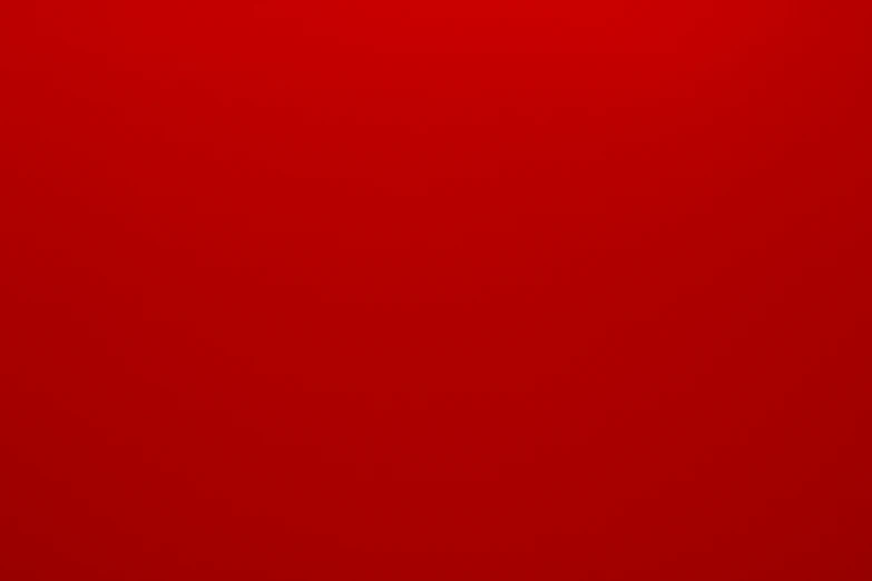 a red background with a black corner