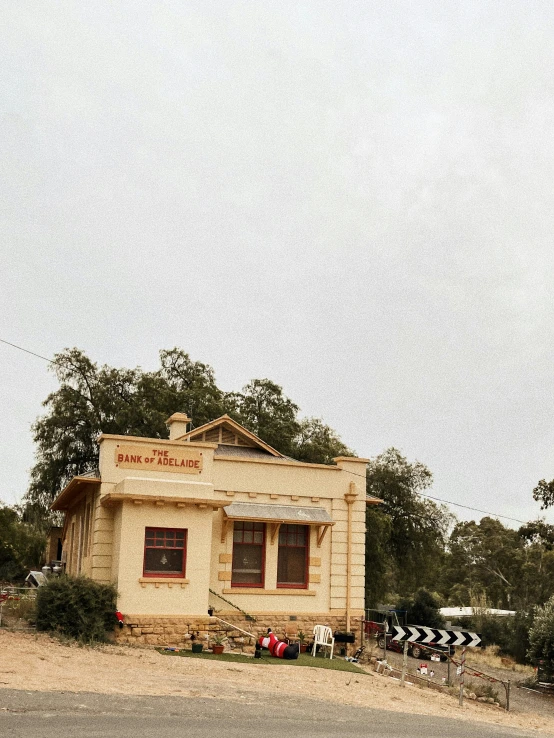 this is a house that has two flags hanging from it