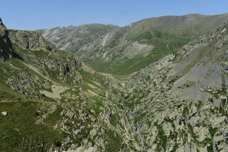 two rocky mountains on both sides of the river