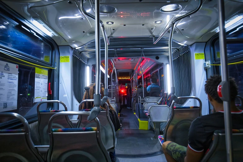 a view from inside of a transit bus with empty seats