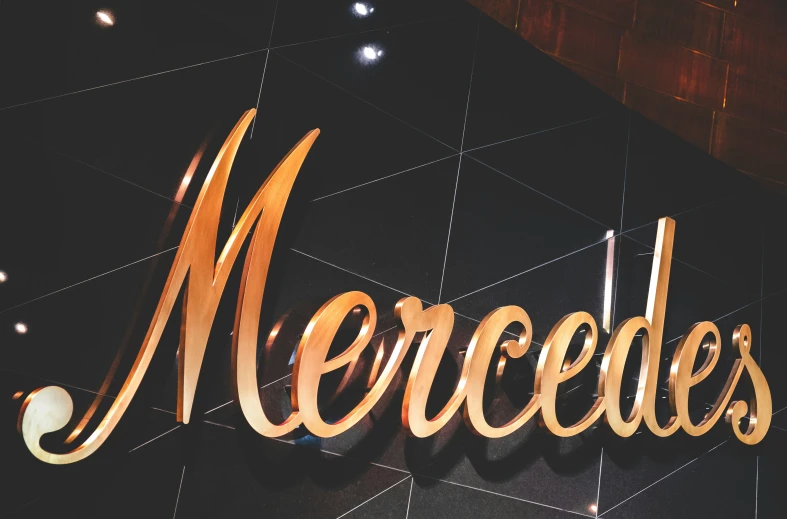 a sign on the wall that says mercedess