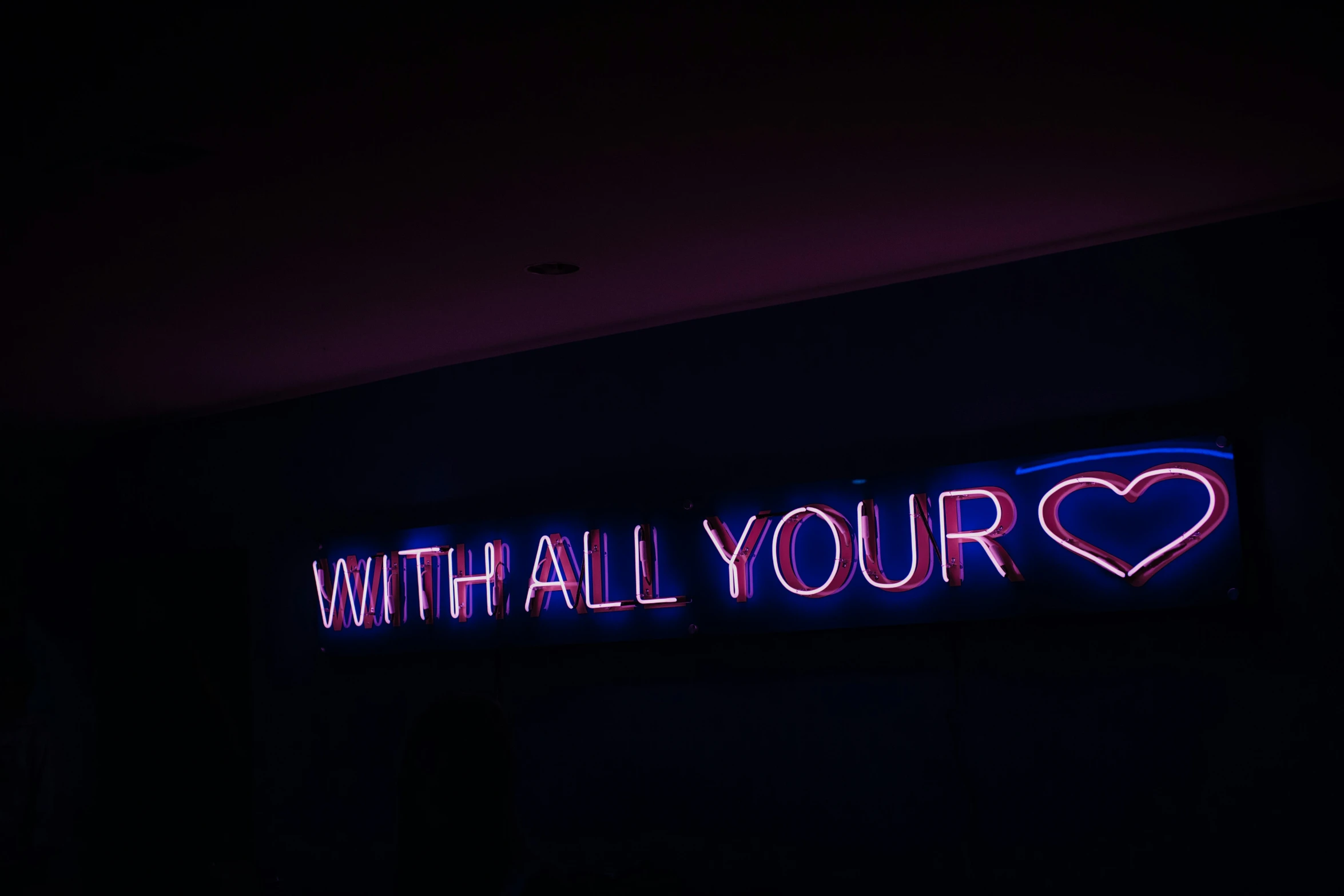 the neon sign has an inscription with all your heart