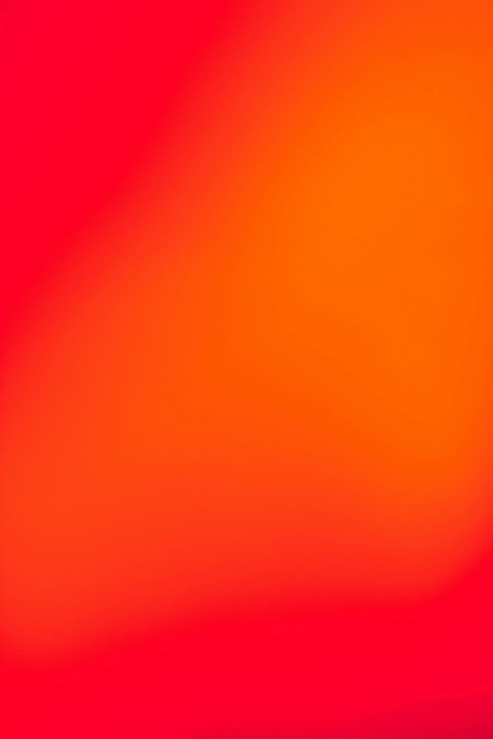 a blurry background with an orange red center