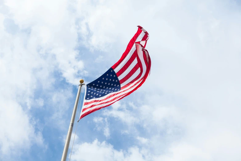 an american flag blowing in the breeze