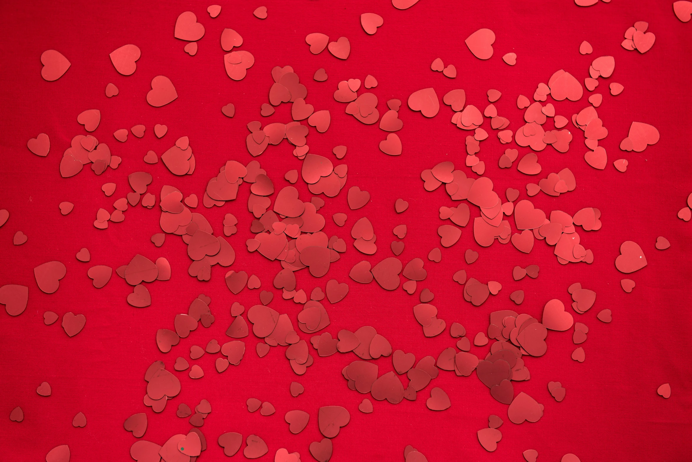 the red heart pattern has many hearts scattered around it