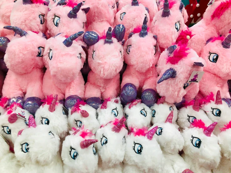 a big pile of little stuffed toys for sale