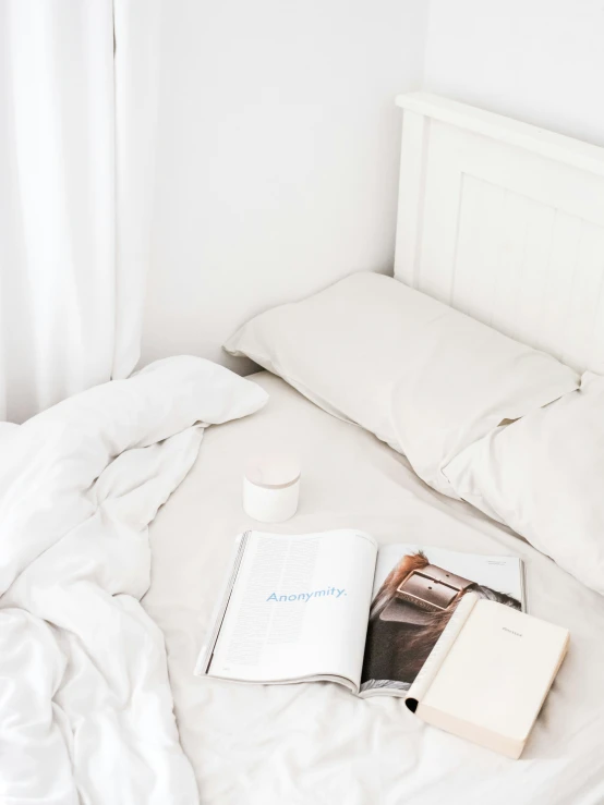 the comforter has a book and a cup on it