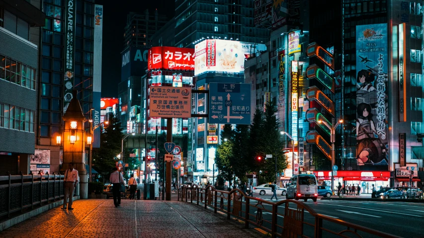 an urban street in the evening with billboards and street signs