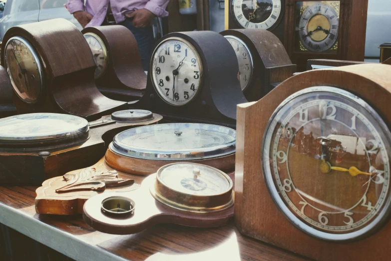 clocks on display next to each other on a table