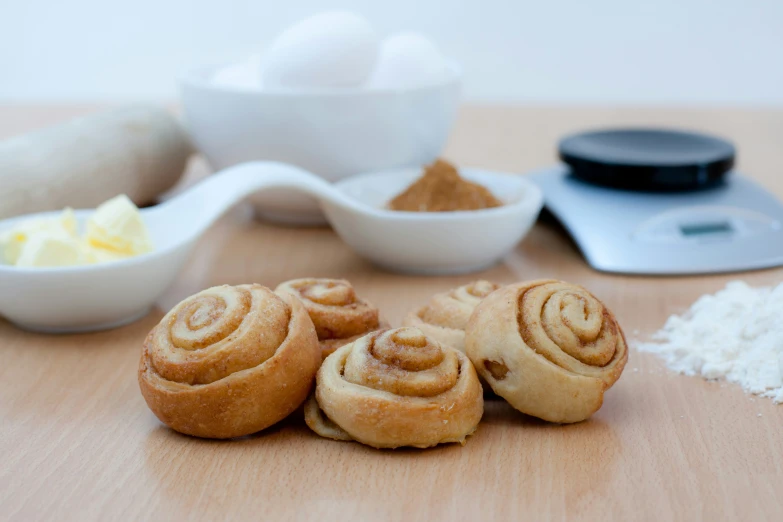 a wooden table topped with sliced up pastry