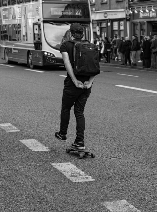 a person on a skate board standing in the street