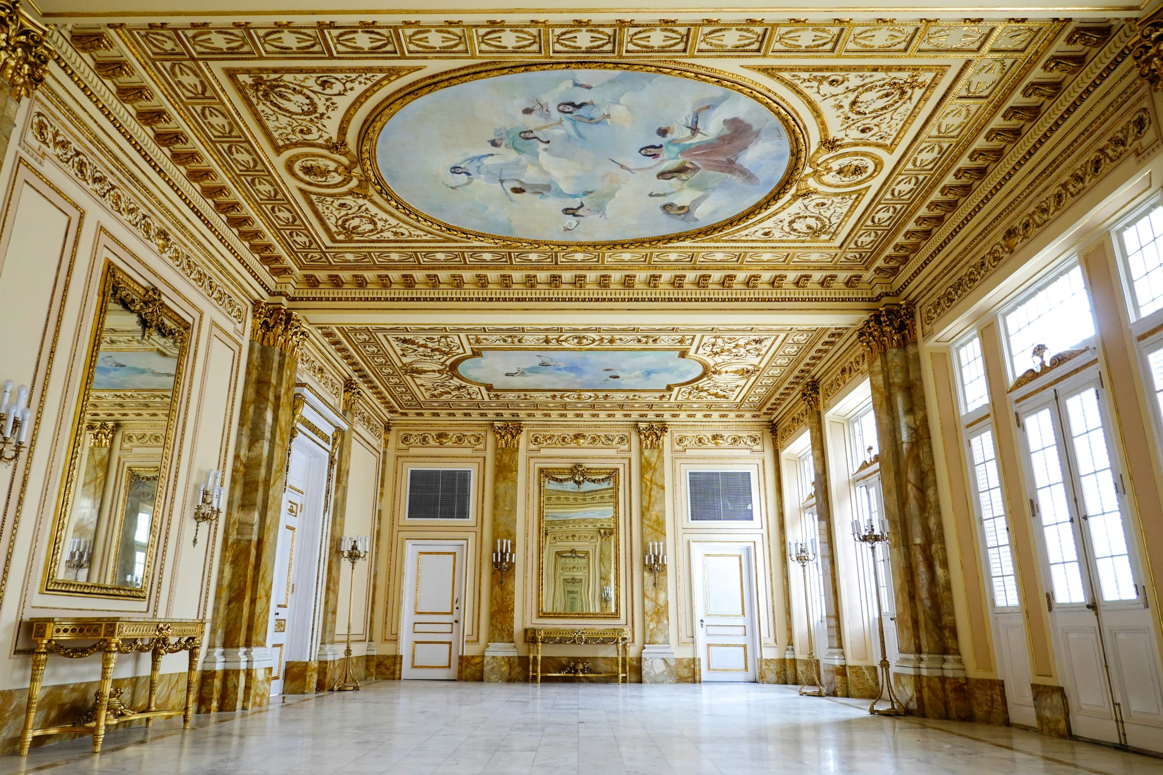 the ornate ceiling is adorned with gilded gold