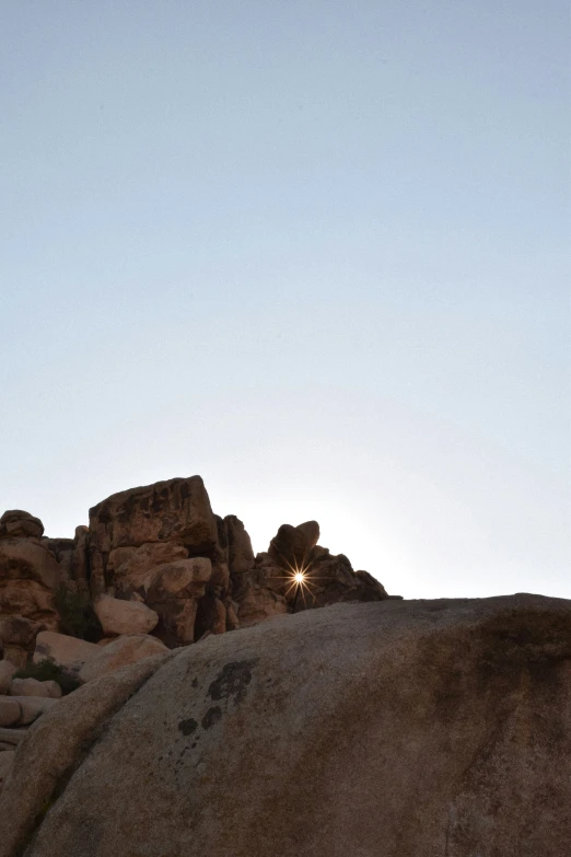 a couple is standing on top of a mountain