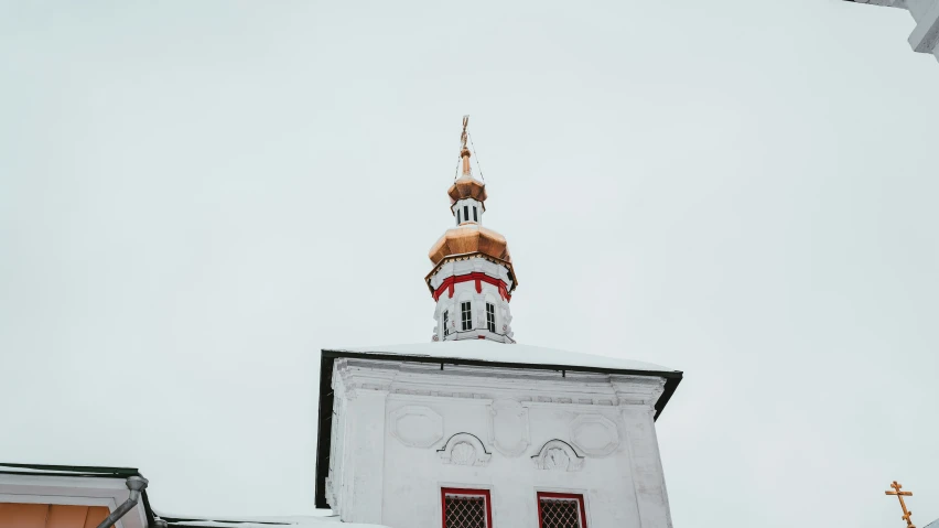 the tower of the building has a clock on it