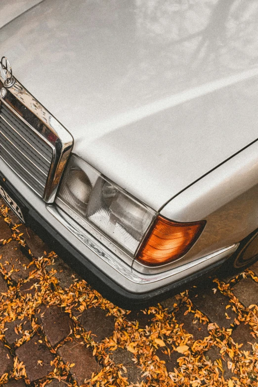 a dirty, dusty old car is sitting on the ground