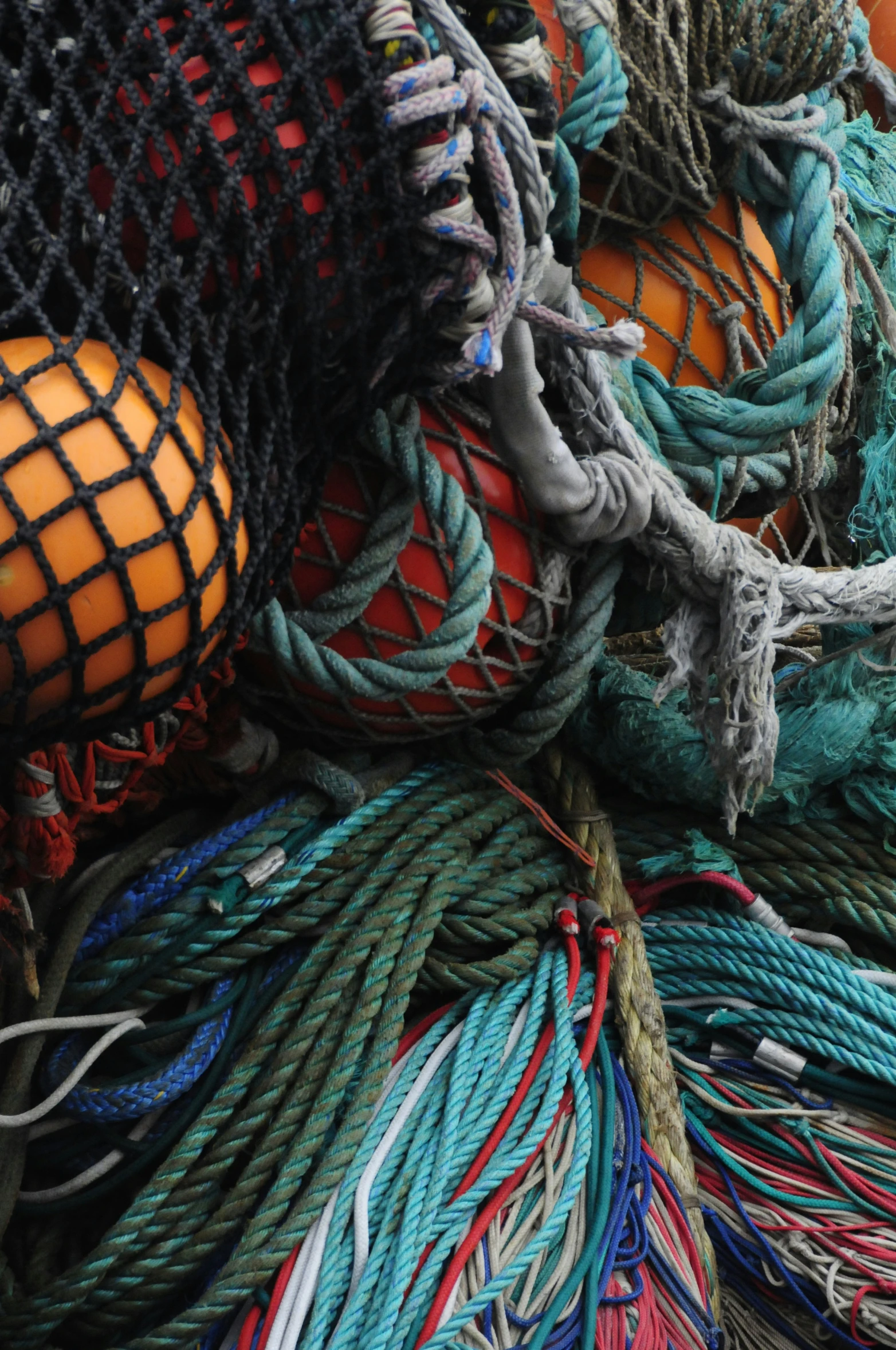 a lot of colorful rope sitting on top of a pile