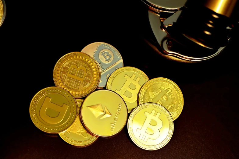 bitcoin coins piled high to the ground with a gold coin on top of them